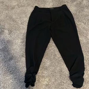 Eva Longoria black pants, rouged fitted cuffs